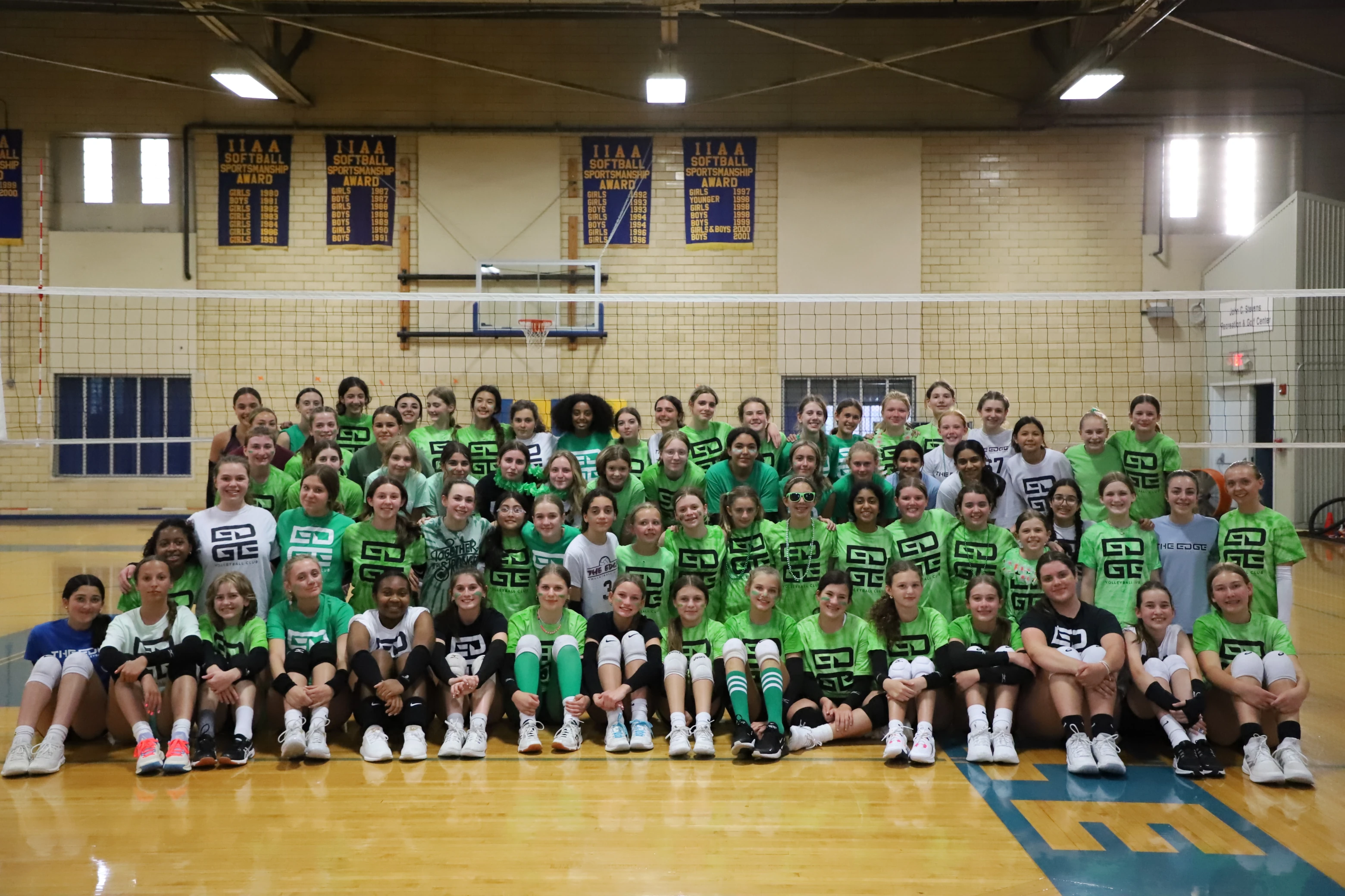 A large group picture of Edge athletes wearing green to support mental health awareness