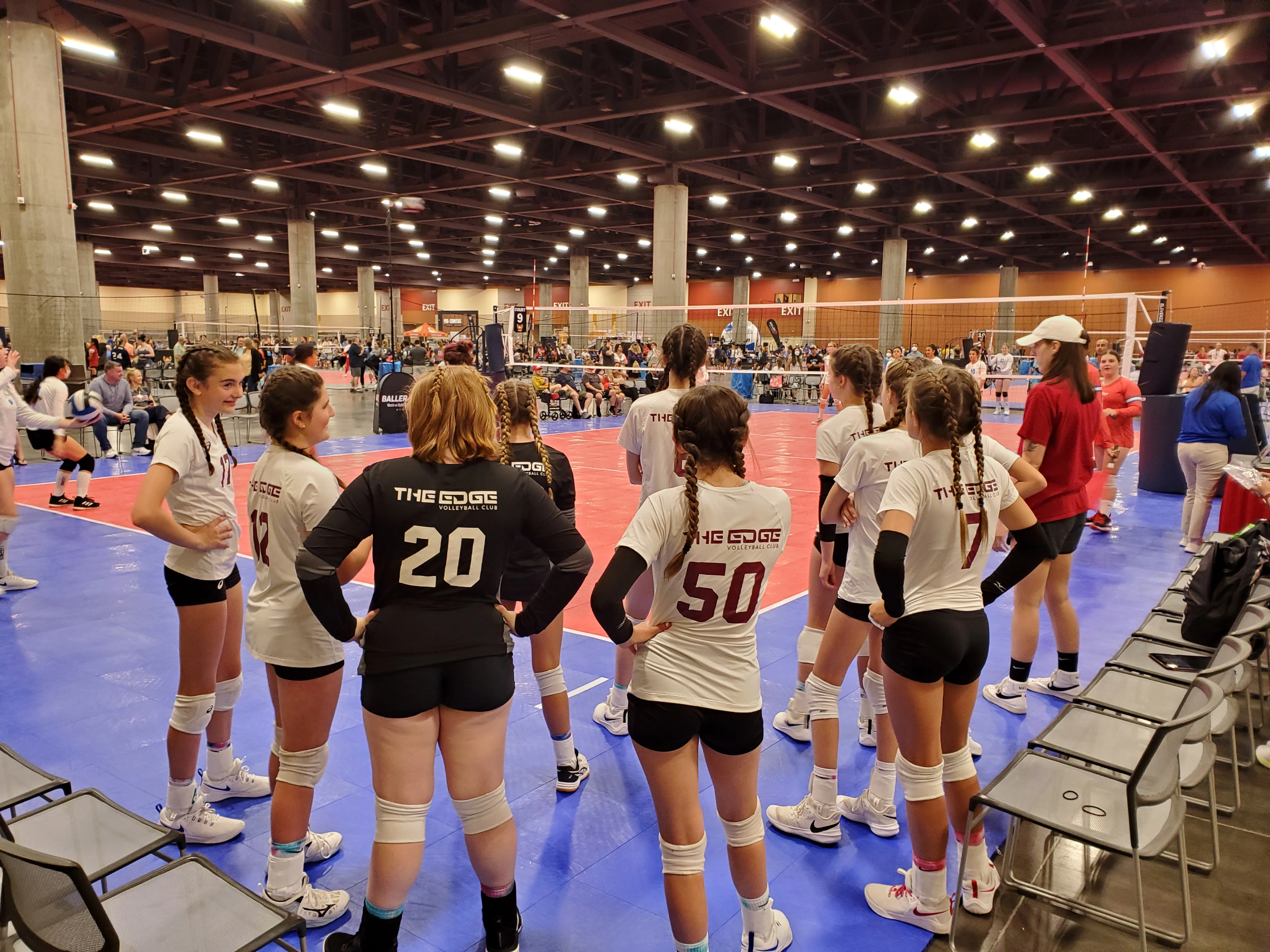 An Edge Volleyball Club team preparing for their upcoming game at a national qualifier tournament