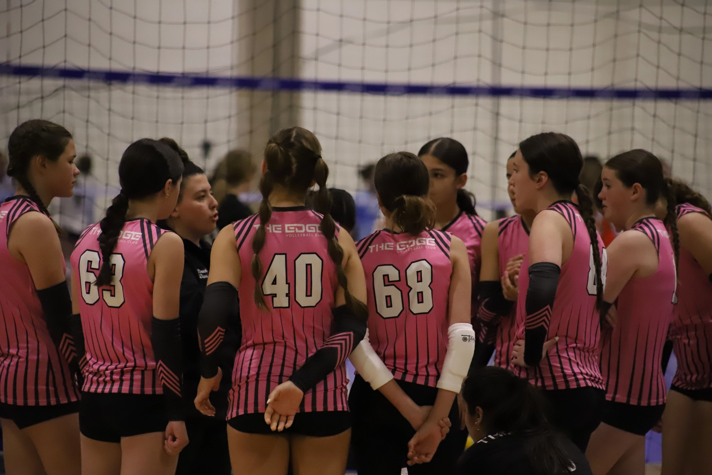 An Edge Volleyball Club team preparing for their upcoming game at a national qualifier tournament